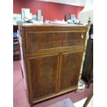 A Mid XX Century Mahogany Cabinet, with fall front over twin drawers on squat cabriole legs.