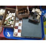 A Staunton Pattern Wooden Chess Set, onyx chess set and board, bone and ebony dominoes, etc:- all