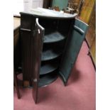 An XVIII Century Oak Bow Fronted Corner Cupboard.