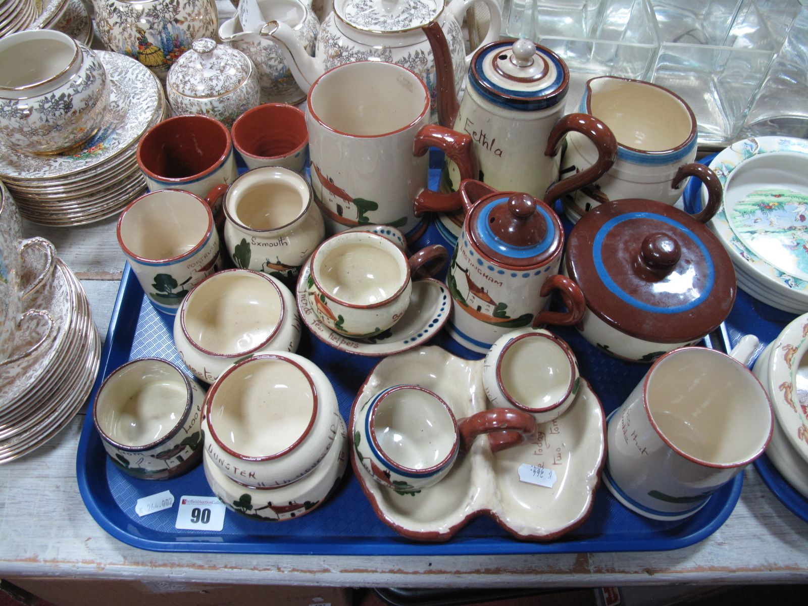 Devon Motto Ware Pottery, including teapots, tankards, hors d'oeuvres:- One Tray