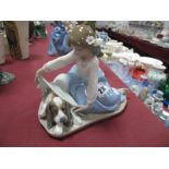A Lladro Pottery Figure of Girl Covering a Dog with a Blanket, C-12 5688.