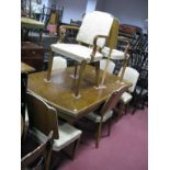 A 1920's Walnut Dining Table, the oval top with moulded edge, on twin pedestals, 80cm high, 74cm