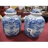 A Pair of XIX Century Tin Glaze Jars and Covers, (finials missing) of ovoid form, painted in blue