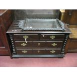 A Portuguese Hardwood Chest, of two short, two long drawers with barley twist side pillars, on