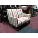 An Early XX Century Two Seater settee, in a striped upholstery, on bobbin and block supports, united