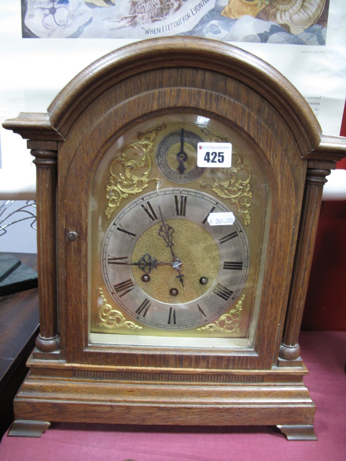 A Gustav Becker Late XIX Century German Oak Cased Mantel Clock, with an arched top, silvered chapter