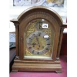 A Gustav Becker Late XIX Century German Oak Cased Mantel Clock, with an arched top, silvered chapter