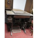 A Late XIX Century Jones Treadle Sewing Machine; together with another Singer treadle sewing