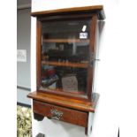 An Edwardian Mahogany Bathroom Wall Cabinet, with stepped pediment, glazed door, two fixed shelves