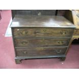 A George III Mahogany Chest of Drawers, the rectangular top with moulded edge, over three long