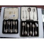 A Set of Six Hallmarked Silver Coffee Spoons, each with shell detail, in a fitted case; together