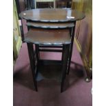 A XX Century Mahogany Nest of Tables, with scalloped edges, on square legs.