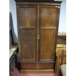 An Early XX Century Mahogany Wardrobe, with twin panelled doors, long drawer, plinth base.