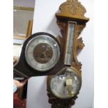 An Early XX Century Oak Aneroid Barometer; together with a Smiths oak cased mantel clock. (2)