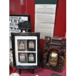 A Chinese Brass Temple Bell, in carved hardwood stand, having glass eyes to sinuous piscine