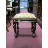 A XIX Century Mahogany Stool, with later upholstered top on turned feet.
