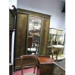 A 1920's Mahogany Double Wardrobe, with stepped cornice, mirrored door and single drawer base, a