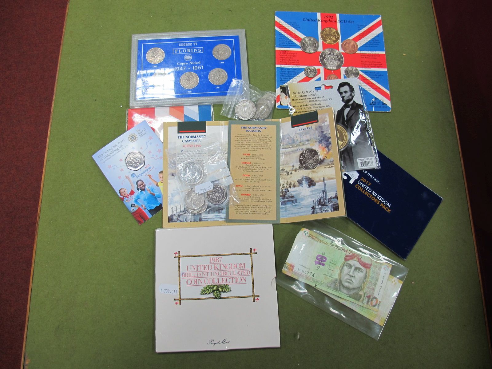A Carded Royal Mint GB BU Coin Collection 1987, United Kingdom ECU set 1992, new one pound coin 2017