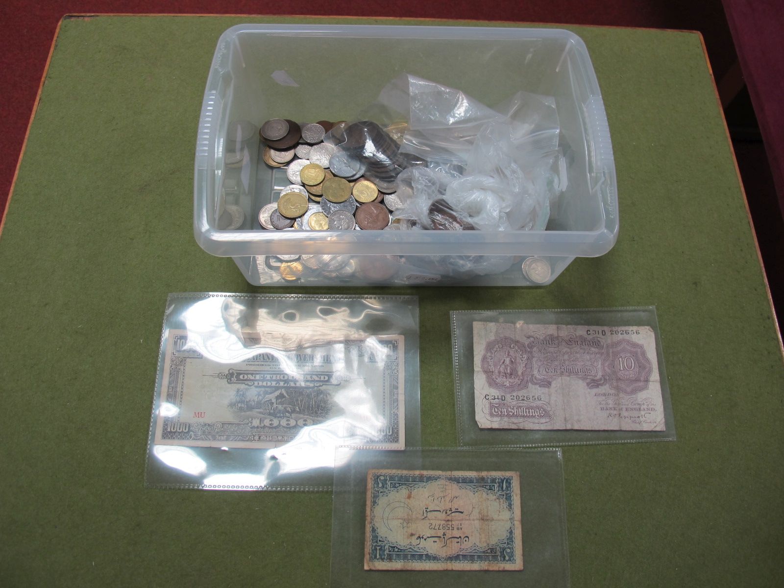 A Low Grade Pepplatt Mauve Ten Shillings Banknote, number C31D 202656. A quantity of G.B and foreign