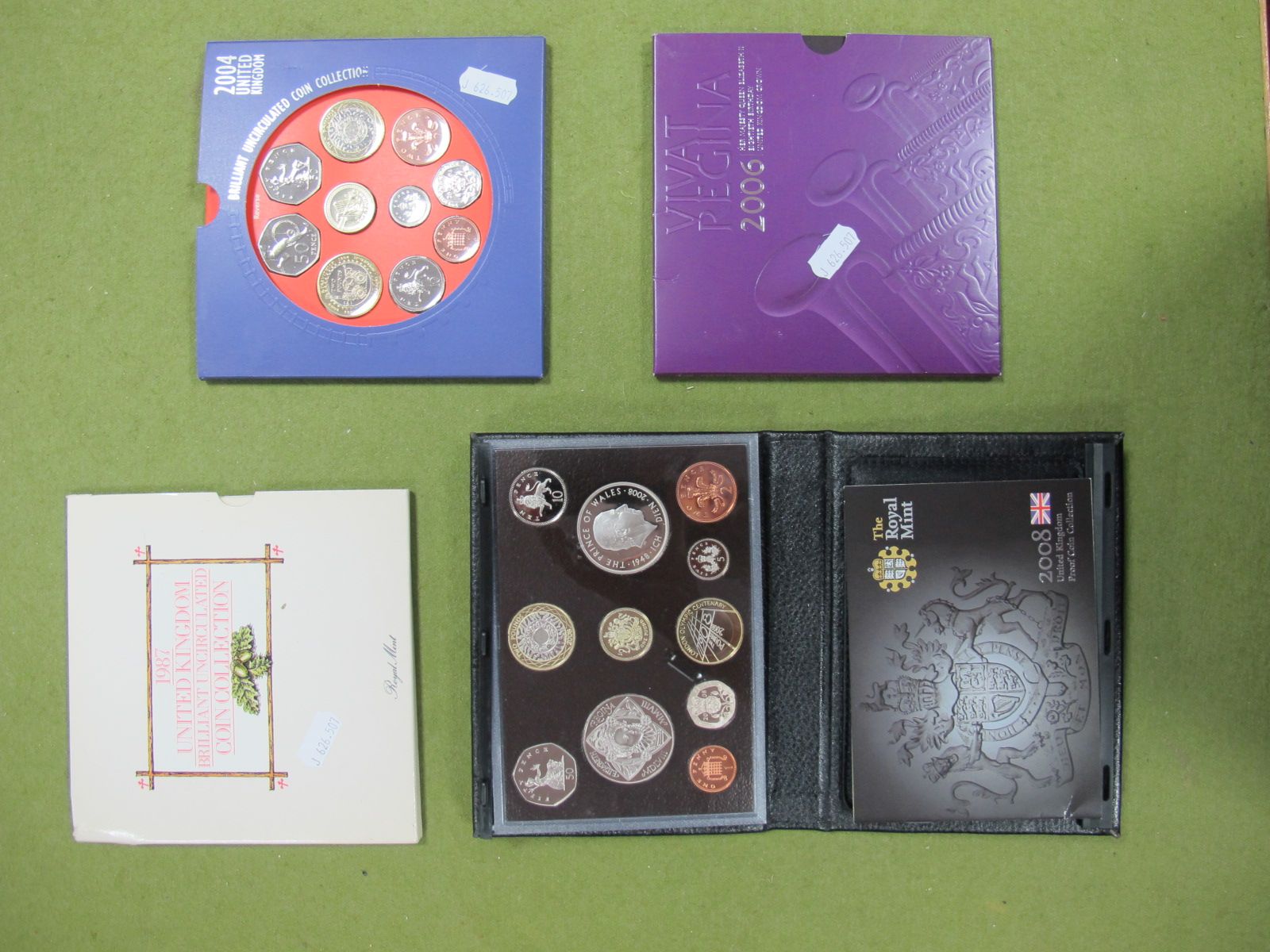 A GB Proof Set, 2008, UK Brilliant Uncirculated coin collections: 1987, 2004 and 2006.