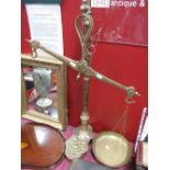 A Set of Brass Balance Scales, with eight graduated weights inset to shaped base.