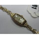 A Chester Hallmarked 9ct Gold Cased Ladies Wristwatch, within tonneau shape case, on openwork