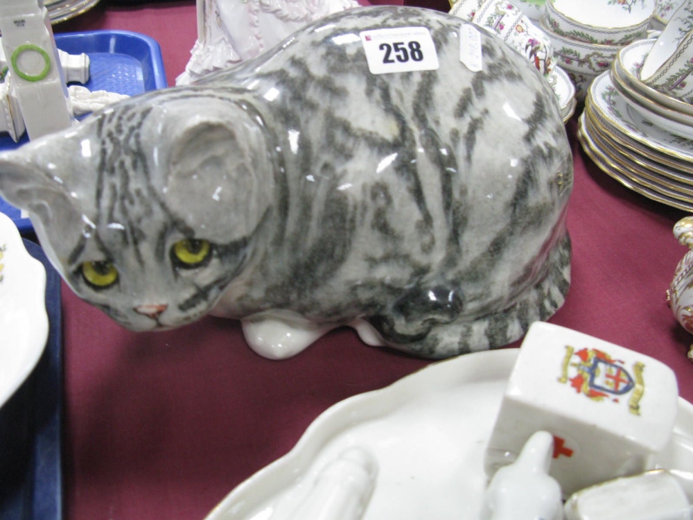 A Winstanley Pottery Tabby Cat, with glass eyes, painted signature and No. '5' under base, 28cm