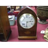 An Edwardian Inlaid Mahogany Arch Cased Mantel Clock, with Roman numerals to cream dial, 23cm high.