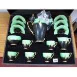 A Carlton Ware Art Deco Black, Green and Gilt Coffee Service, comprising six saucers, six cups,