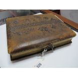 A Late XIX/Early XX Century Brown Leather Photograph Album, (with photographs).