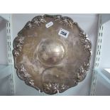 A Decorative Dish, of shaped circular form, detailed in relief with leaves, engraved to the