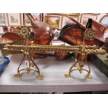 Three Piece Brass Rope Twist Fire Irons Set; together with dogs having rose finials.