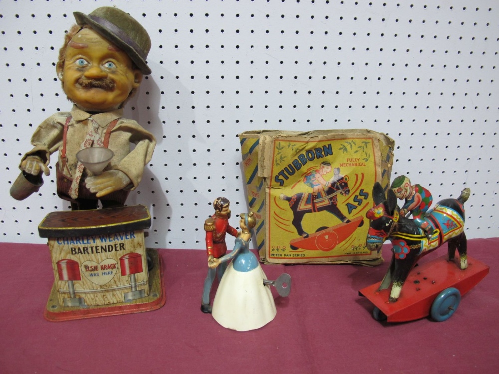 A Japanese Battery 'Charlie Weaver' Toy, a Peter Pan clockwork stubborn donkey and clockwork