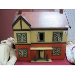 A Mid XX Century Dolls House, single door opening, six rooms, frontage to house has six windows,