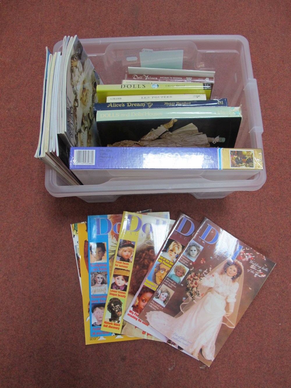 A Quantity of Books on Dolls, including a modern doll related jigsaw, unopened.