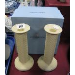 A Pair of Wedgwood Yellow Matt Pottery Candlesticks, with chevron decoration to cylindrical