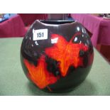 A Poole Pottery Ovoid Vase, decorated with flame coloured leaves on dark ground, 18cm high.