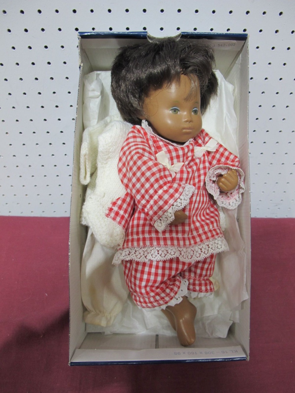 A Sasha Brunette Female Doll, 30cm tall.