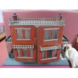 A Substantial Late XIX Century/Early XX Century Double Fronted Dolls House, in the form of a