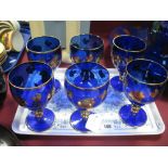 A Set of Six Blue Glass Goblets, with gilt vine decoration. (6)