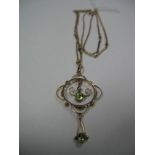 An Edwardian Openwork Pendant, oval and circular collet set, stamped "9ct"; on fancy link chain.