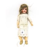An Early XX Century Bisque Headed Doll, Simon Halbig, stamped 1909, sleepy eyes, open mouth with