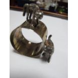 A Novelty Hallmarked Silver Napkin Ring, with applied dog and cat, in original fitted case.
