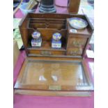 An Early XX Century Oak Stationery Box, with lift up top, glazed drop door, sectional