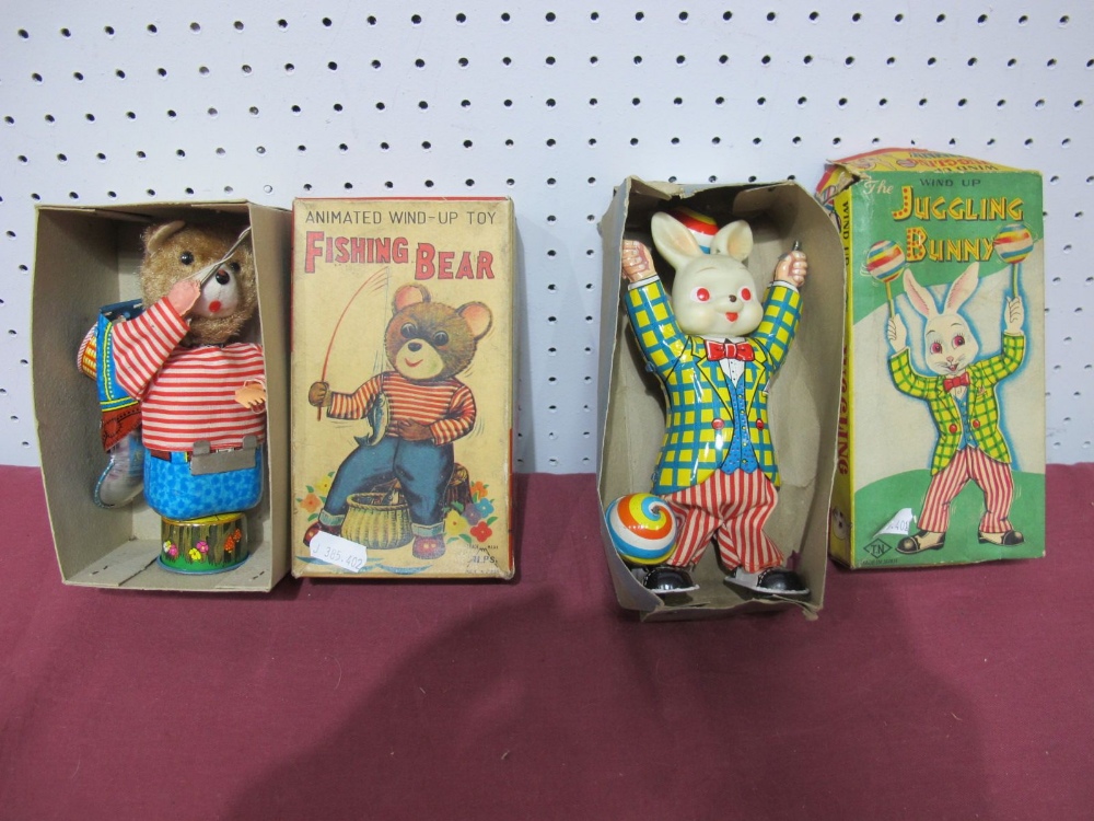 Two 1960's Japanese Clockwork Toys, ' Fishing Bear', by Alps and 'The Juggling Bunny' by TN, both