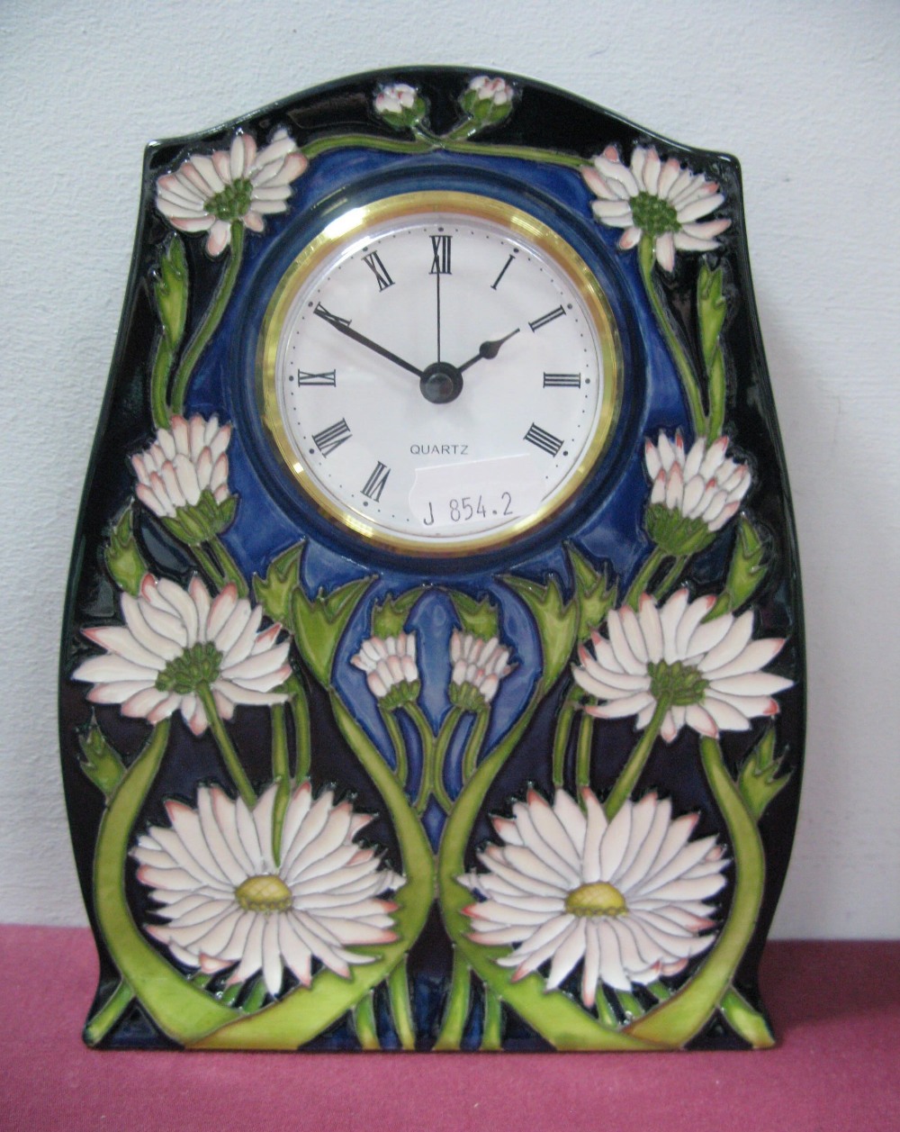 A Moorcroft Pottery Clock, in the Meadow Daisy design by Paul Hilditch, impressed and painted