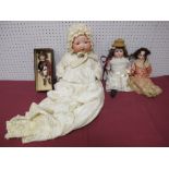 An Armand Marseilles Baby Doll, plus three other bisque headed dolls. Two with signs of cracks to