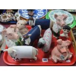 Four Natwest Pigs, resin figures of sheep dressed up in a rugby shirt and football shirt, etc.