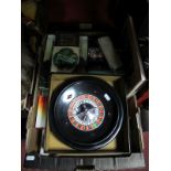 A Table Top Roulette Wheel, vintage darts, cased dominoes, wooden games box, a Silstar graphite