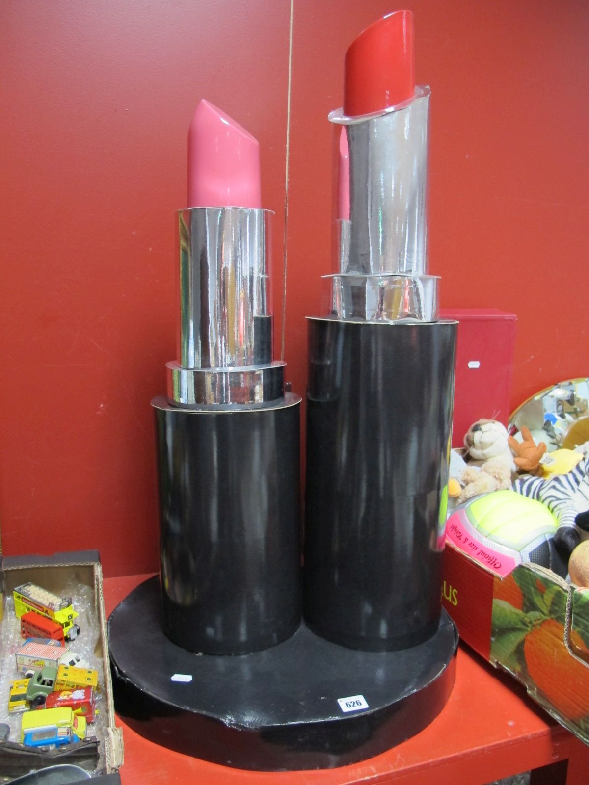 A Large Modern Shop Display, formed as two lipsticks, height 89cm.